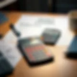 A calculator and student loan documents on a desk