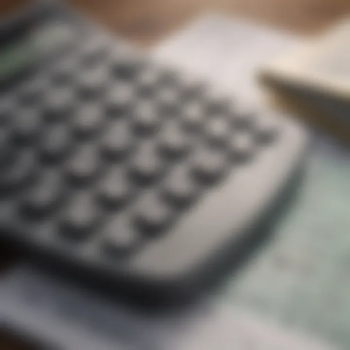 A close-up of a calculator and financial documents illustrating budgeting