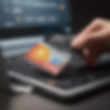 A close-up of a credit card alongside a laptop