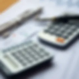 A calculator and financial documents indicating loan calculations
